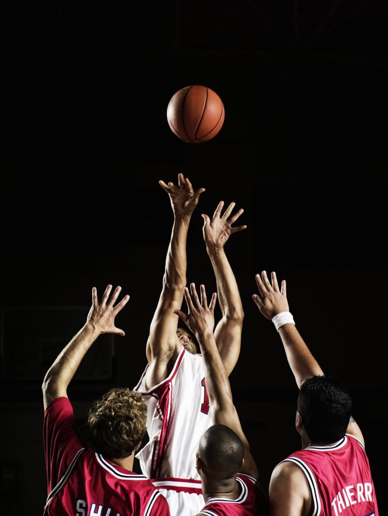 Players Trying to Block Shot